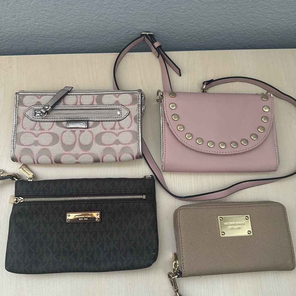 3 wallet clutch - 2 Michael Kors and 1 Coach 
1 cross body bag - Nine West